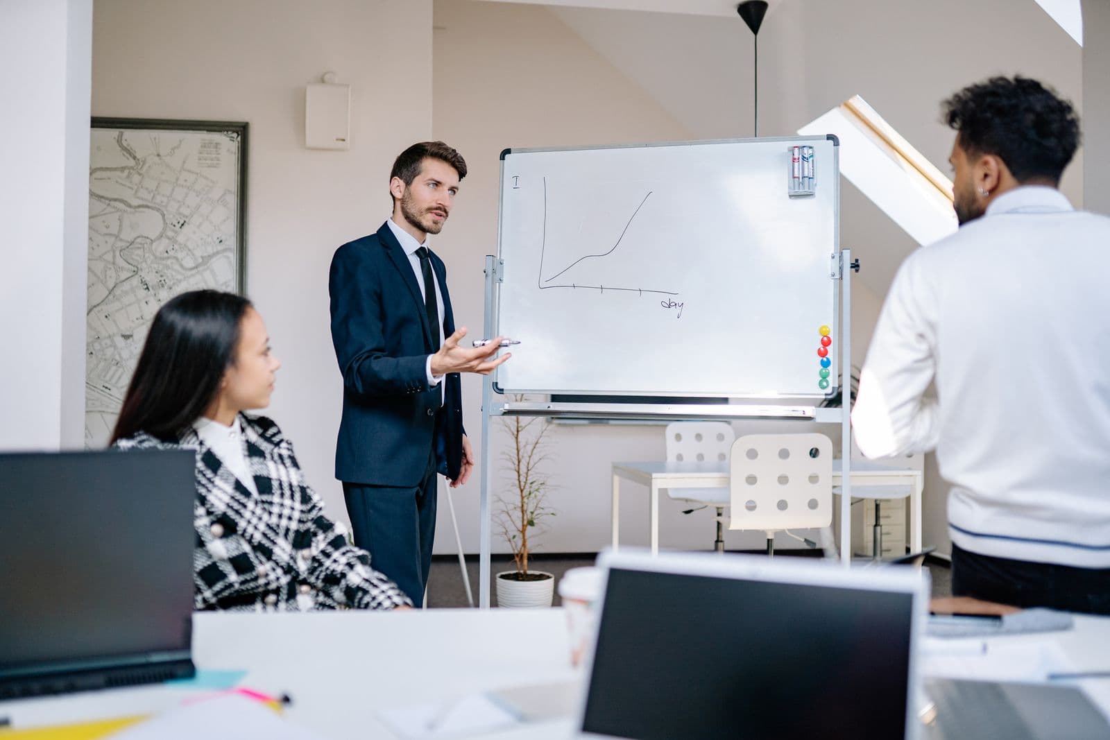 A young team presenting a growth plan at a whiteboard