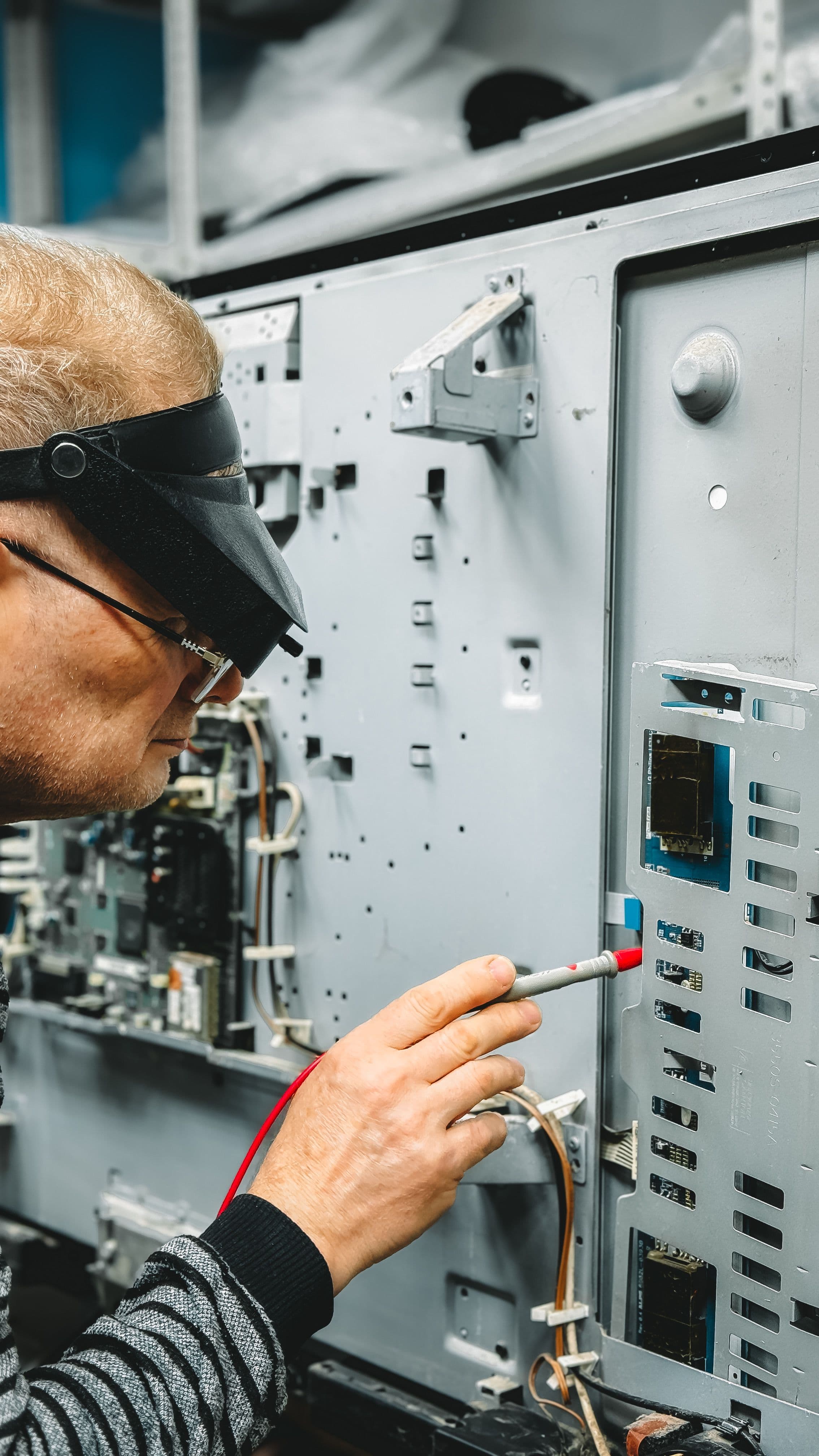 Engineering service specialist inspecting technical equipment